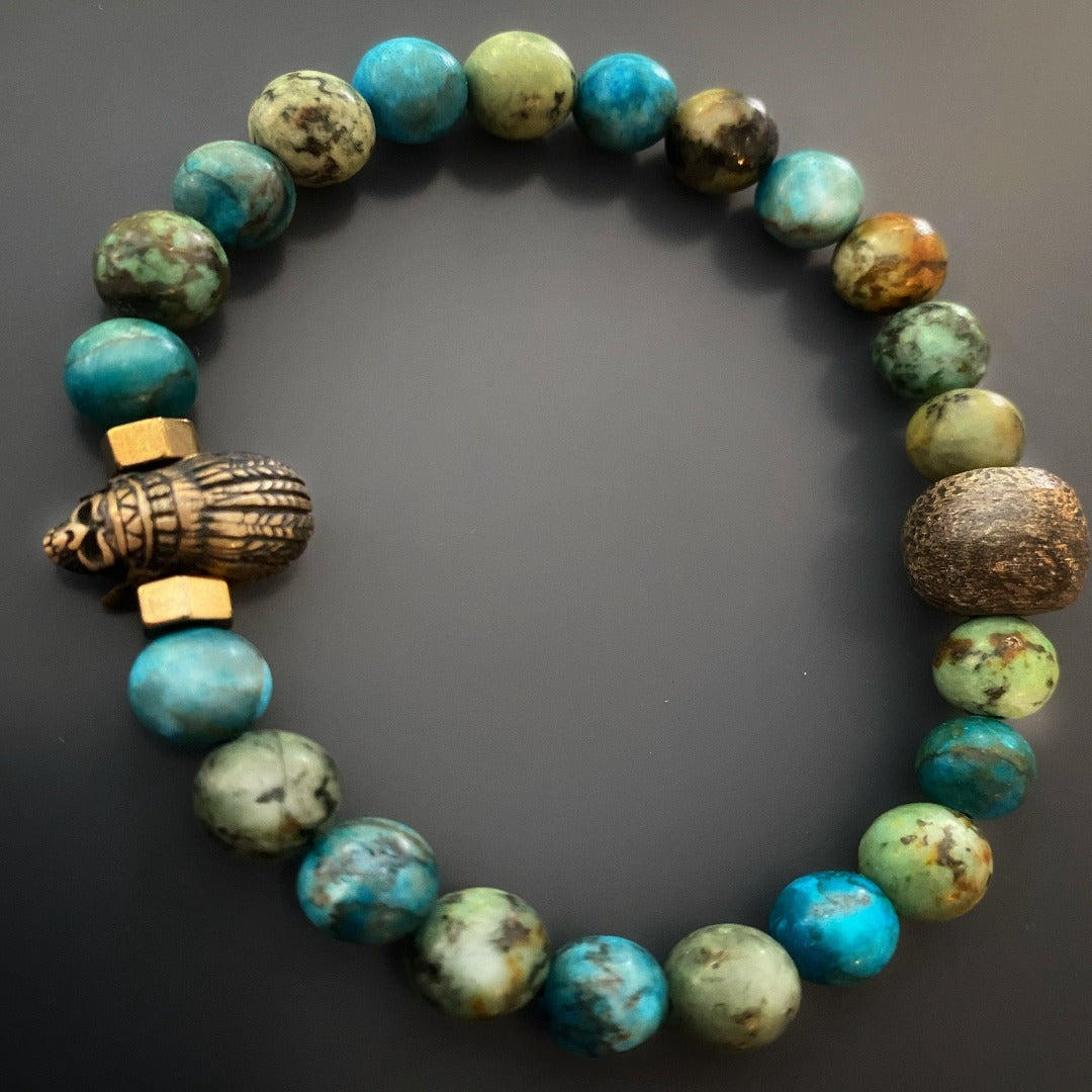 the Indian Men Bracelet, showcasing its vibrant turquoise stone beads and the intricately designed bronze gold-plated Indian accent bead.