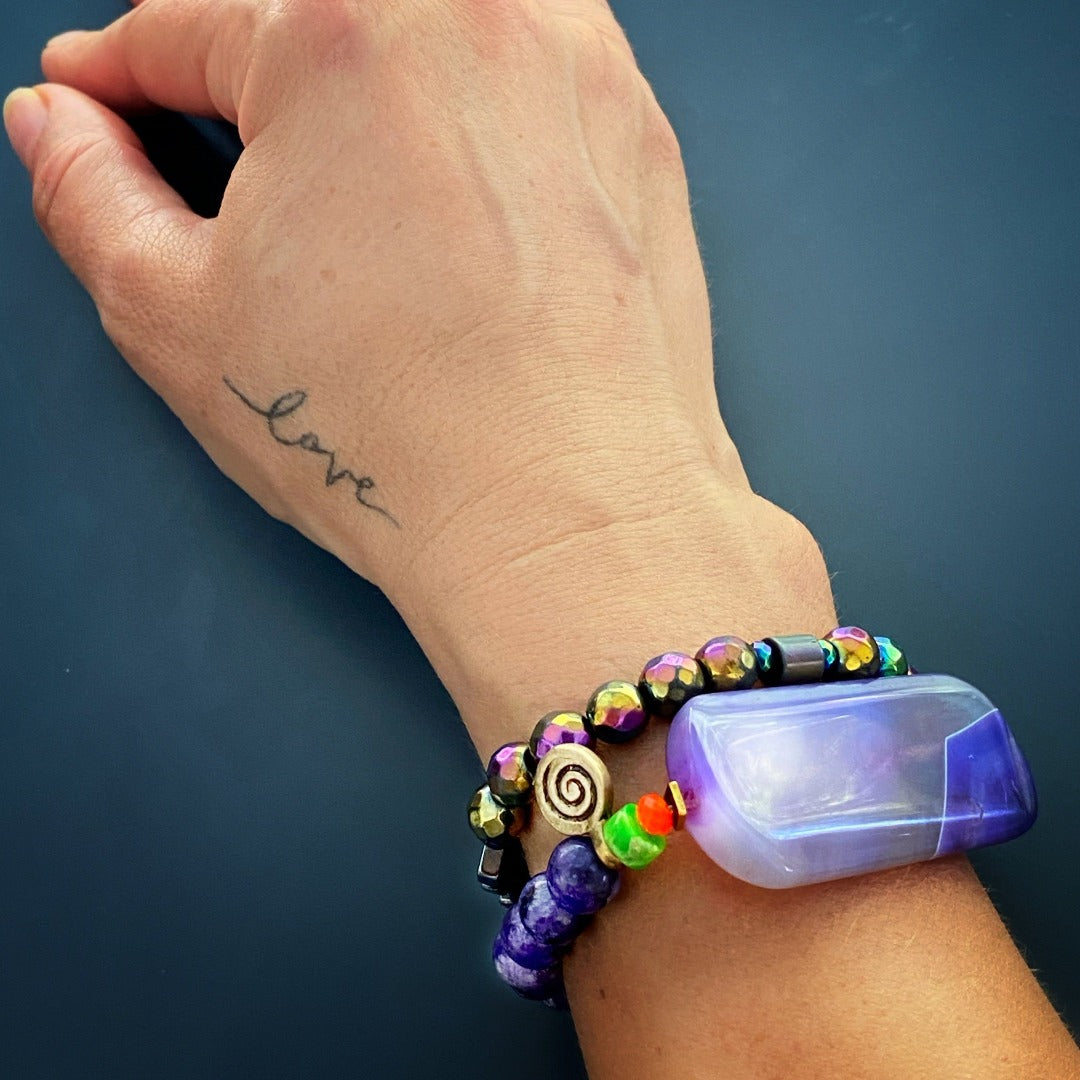 Find inner peace and balance with the stunning Amethyst Meditation Bracelet, modeled here for inspiration.