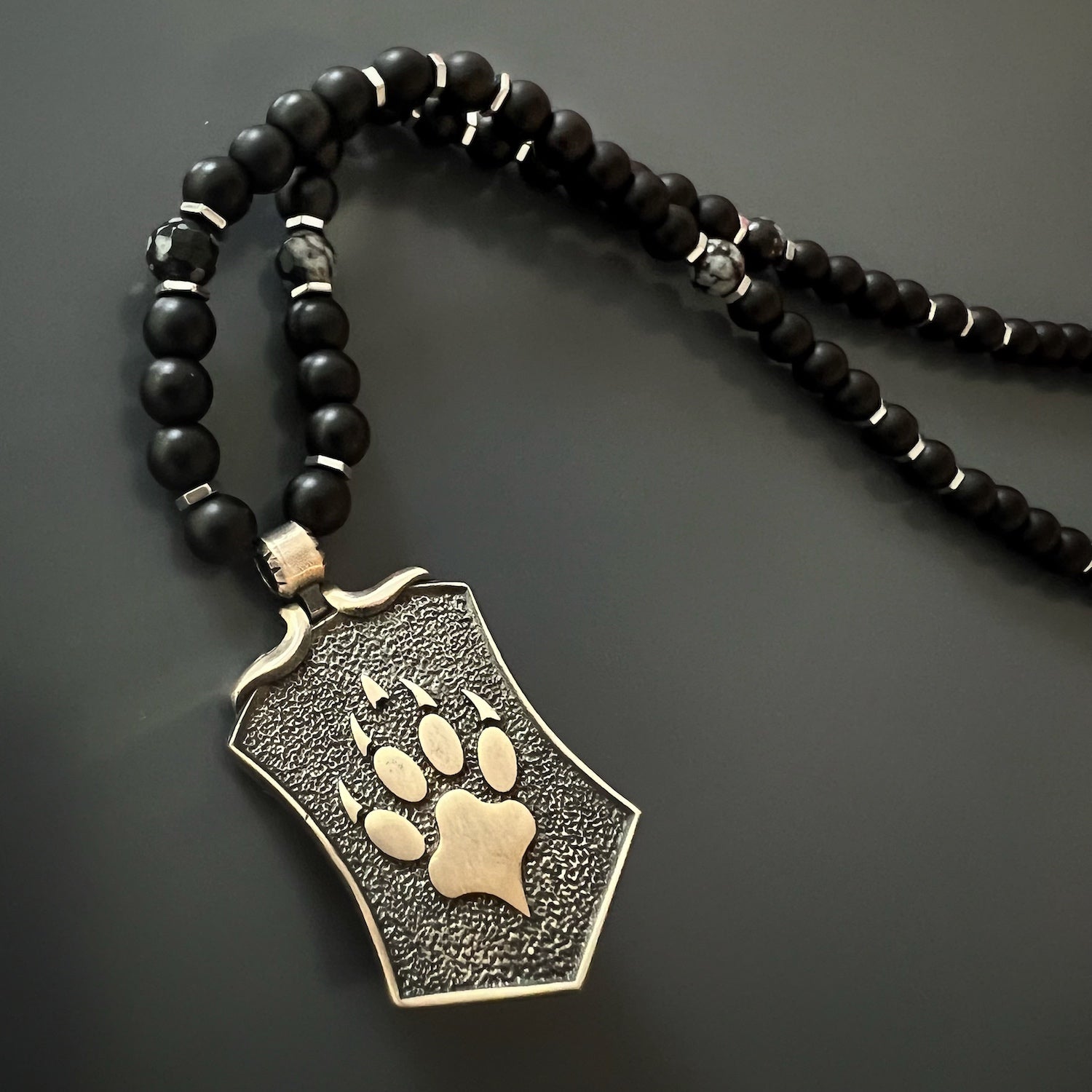 Discover the essence of strength and freedom with the Spirit Onyx Wolf Necklace, a remarkable jewelry piece.