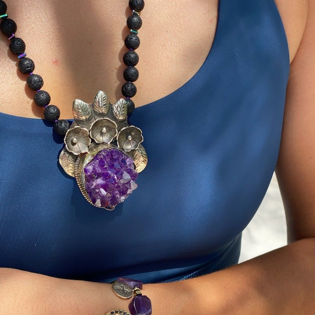 The Spiritual Amethyst Necklace beautifully adorning the model, showcasing its unique design and spiritual significance.