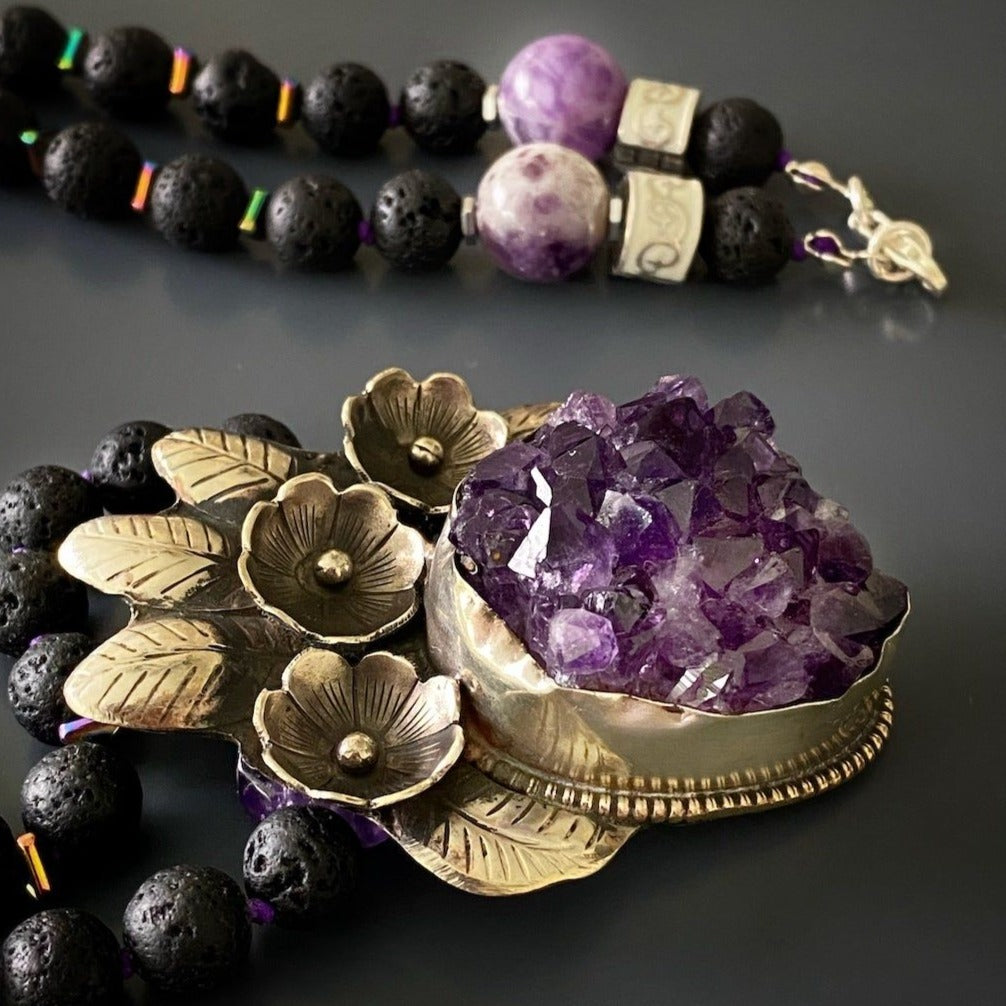 Handmade necklace featuring a striking silver pendant with an amethyst row stone, perfect for spiritual healing.