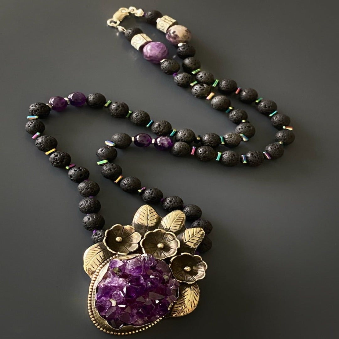 Handmade necklace crafted with natural amethyst and lava rock stones, promoting spiritual healing and tranquility.