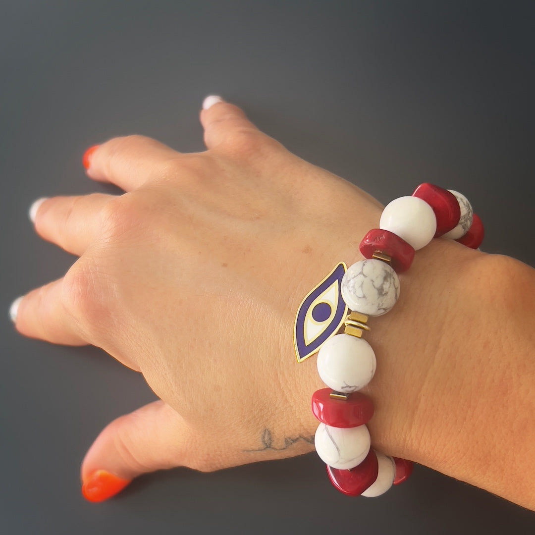 The hand model wears the Spiritual Beads Evil Eye Bracelet, showcasing its unique design and spiritual energy.