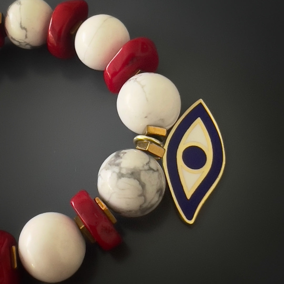 Experience the unique energy of the Spiritual Beads Evil Eye Bracelet, designed with white howlite, red coral, and a sterling silver evil eye charm.