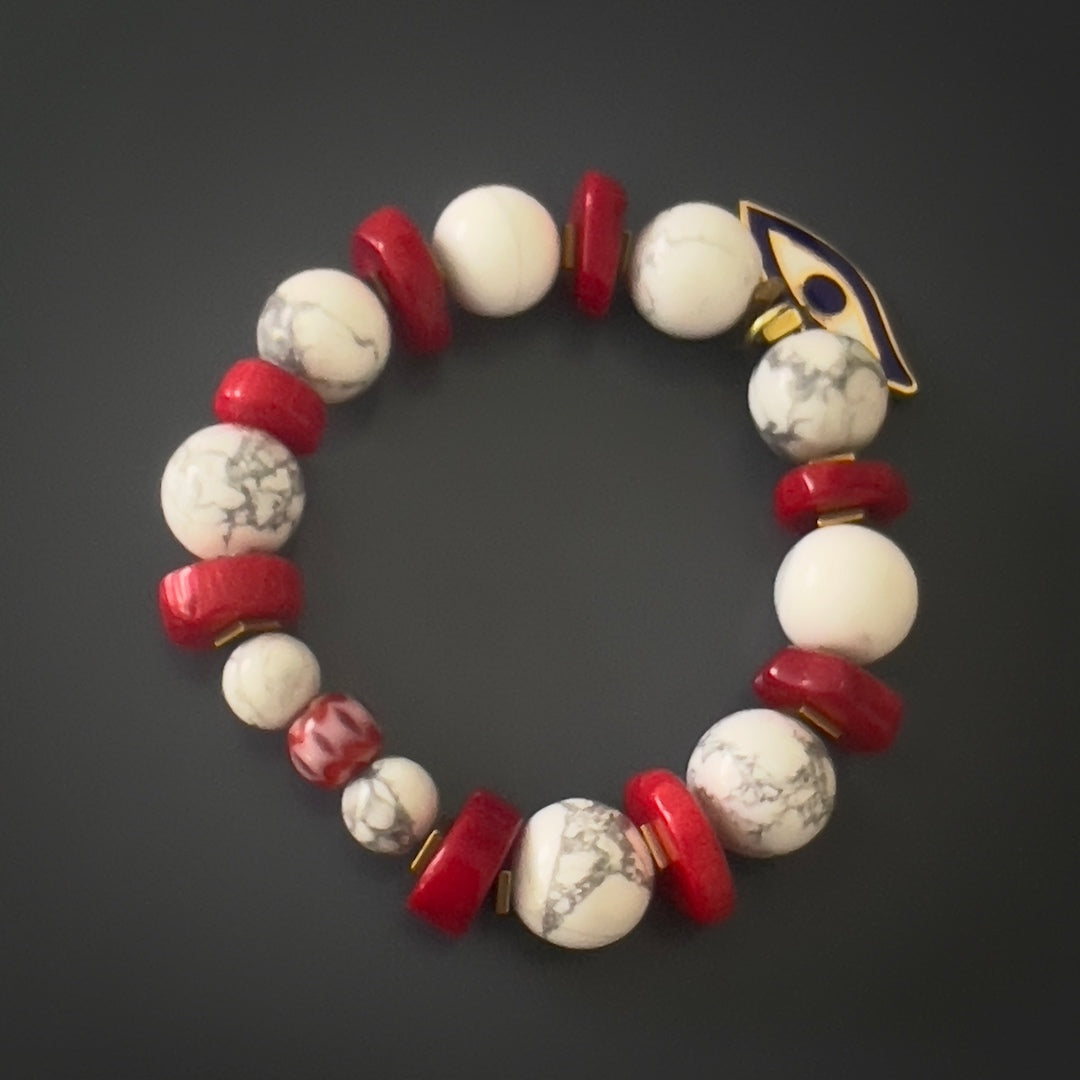 The Spiritual Beads Evil Eye Bracelet exudes meaning and style, with its combination of white howlite, red coral, and gold hematite.