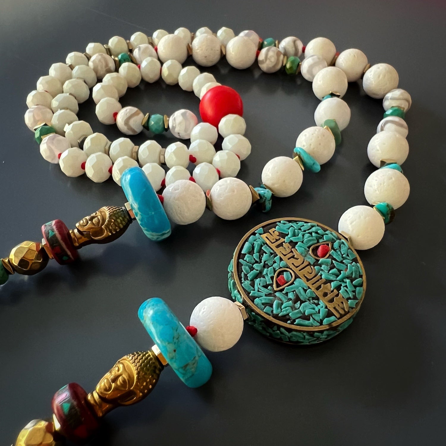 Enchanting Beauty: Gold-colored hematite and Nepal meditation beads on the Mantra Necklace.