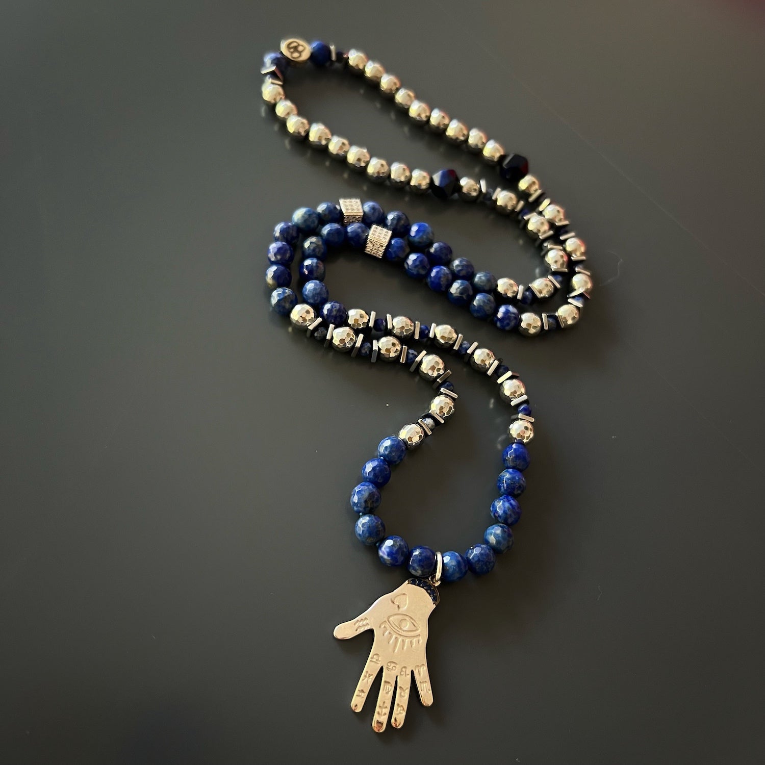 Hamsa Hand Pendant with Lapis Lazuli - Embrace the spiritual symbolism of this unique necklace.