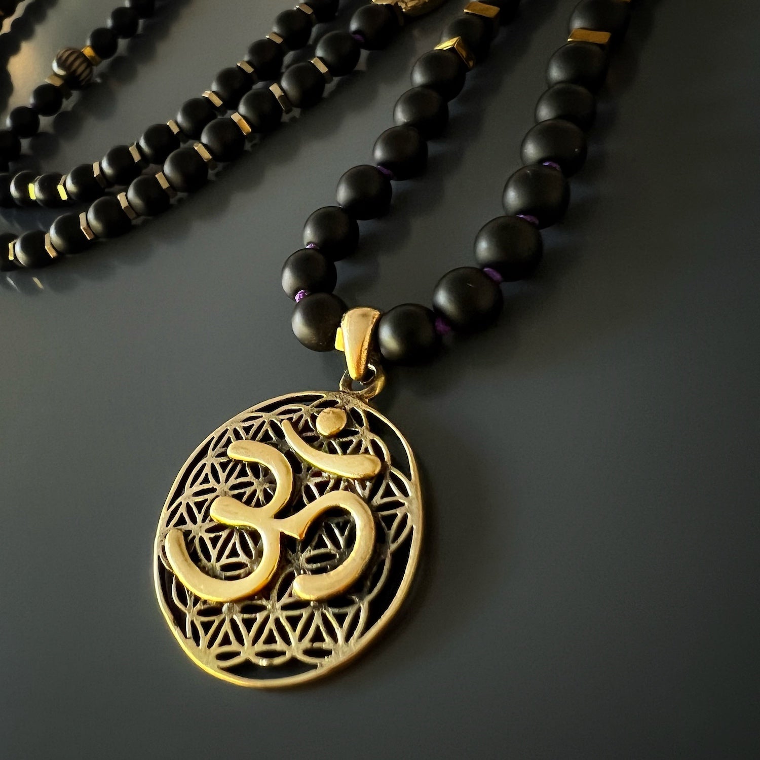The Spiritual Yoga Mala Onyx Necklace, showcasing its black onyx stone beads