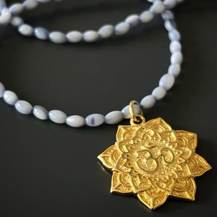 Spiritual Journey Yoga Necklace featuring a lotus and Om mantra pendant for inner peace.