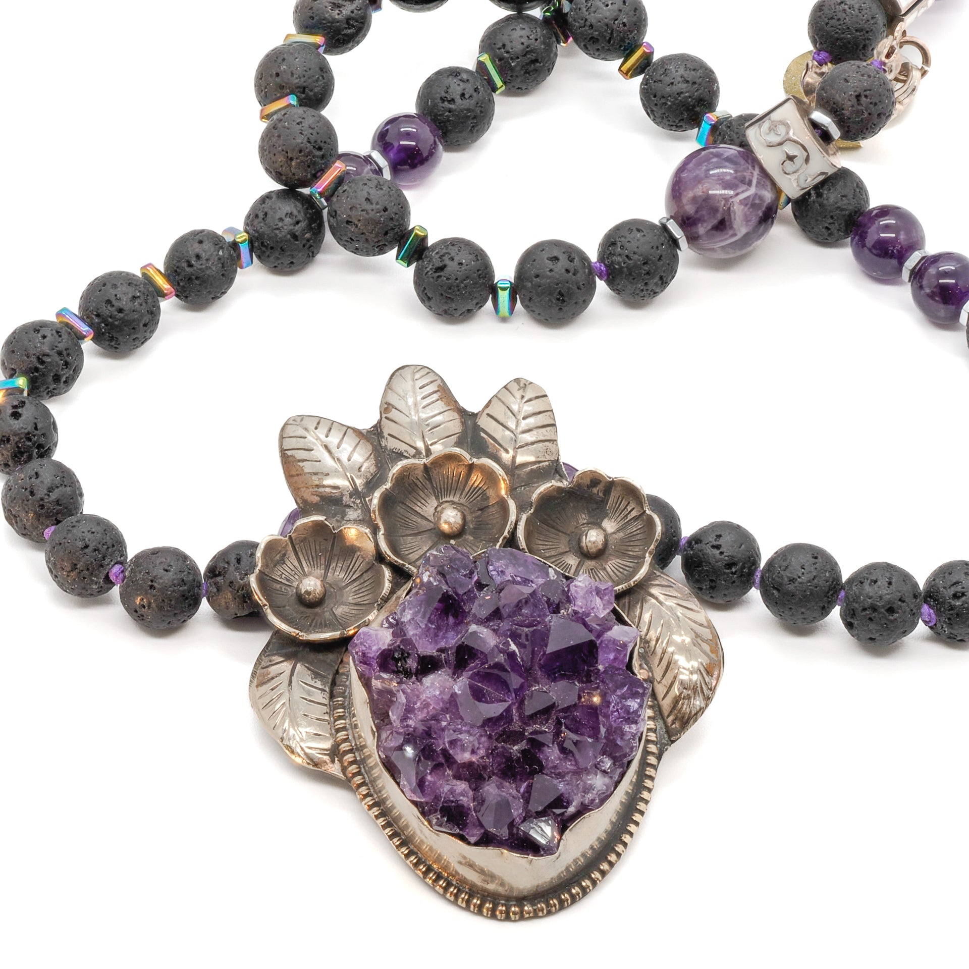 Handmade necklace featuring a stunning combination of amethyst and lava rock stones for spiritual healing and tranquility.