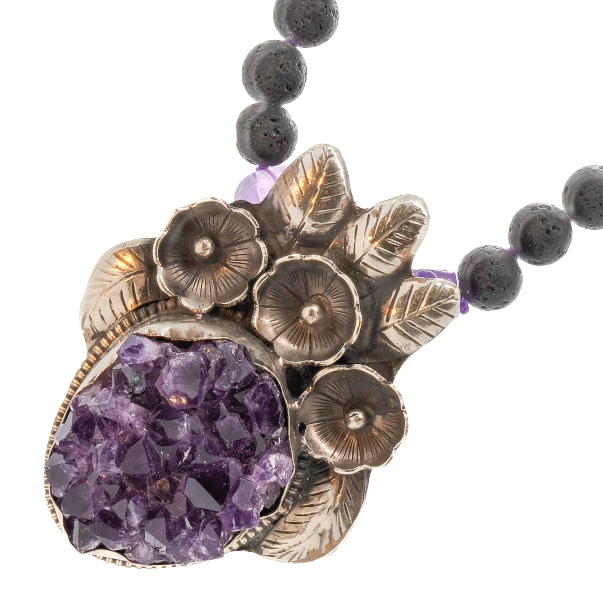Necklace adorned with a gorgeous flower silver pendant and amethyst beads, promoting calmness and spiritual connection.
