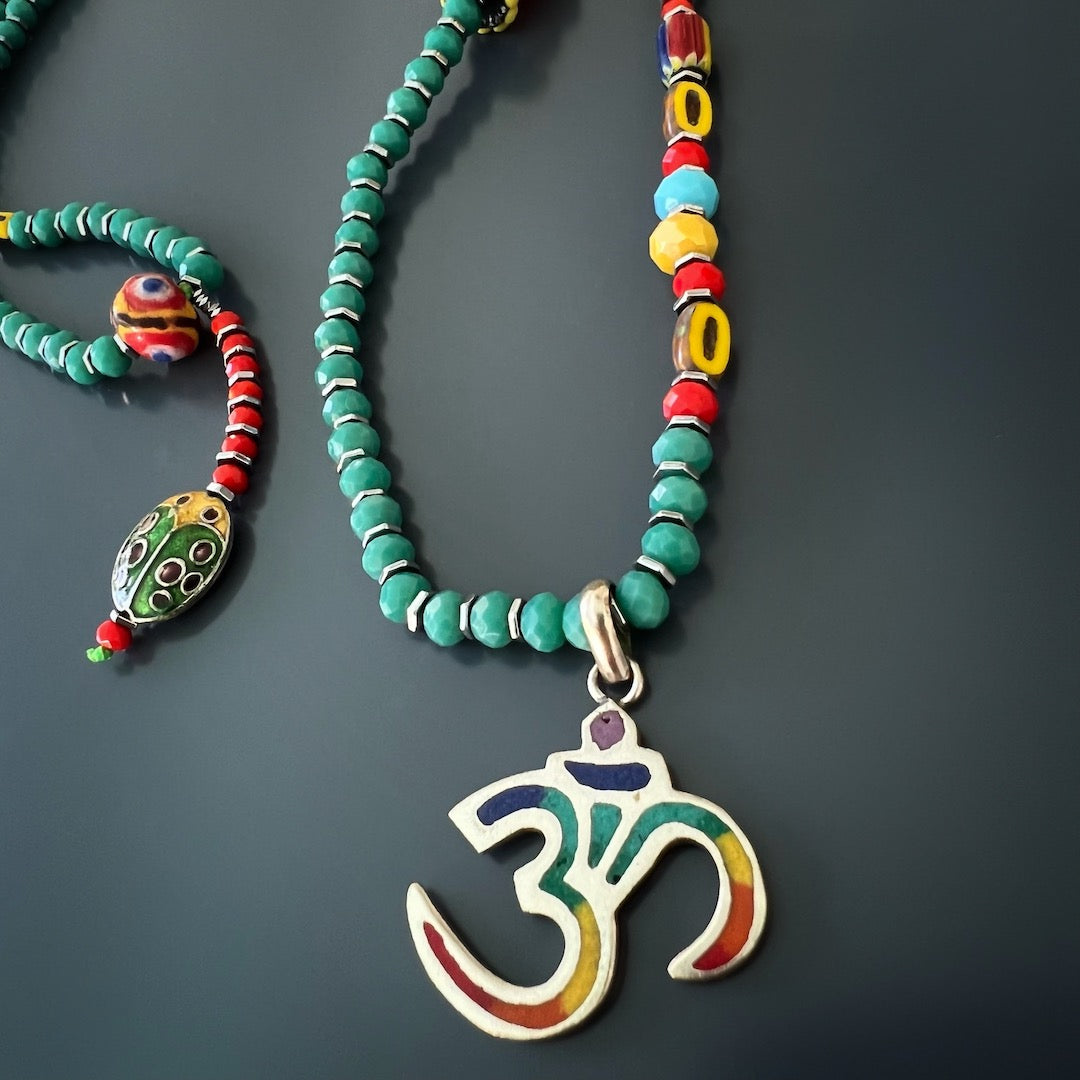 Vibrant African beads and Om pendant adorn the Summer Vibes Yogi Necklace for a unique touch.