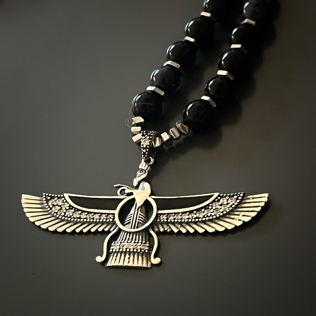 Spiritual Elegance - The Handcrafted Necklace Combines Tourmaline Beads with a Sterling Silver Faravahar Pendant.