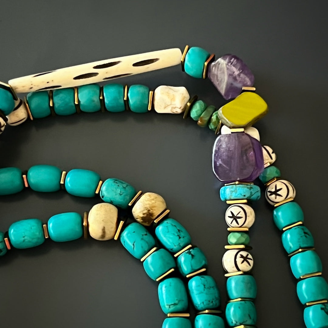 Crafted with Care - The Handmade Necklace Combines Turquoise and Amethyst Beads with a Gold Hematite Spacer.