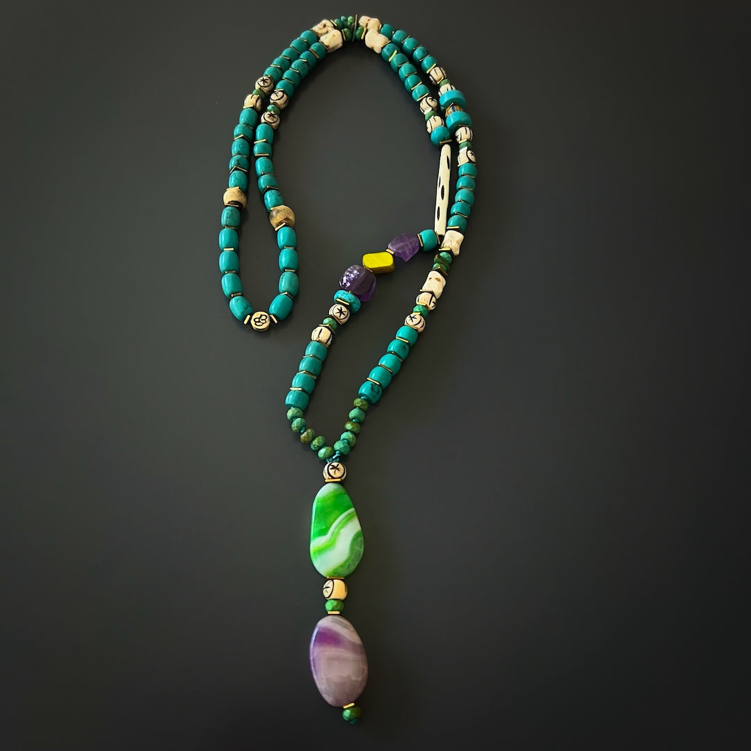 Balancing Energy - The Handcrafted Necklace Promotes Harmony and Calmness with Turquoise and Amethyst Stones.