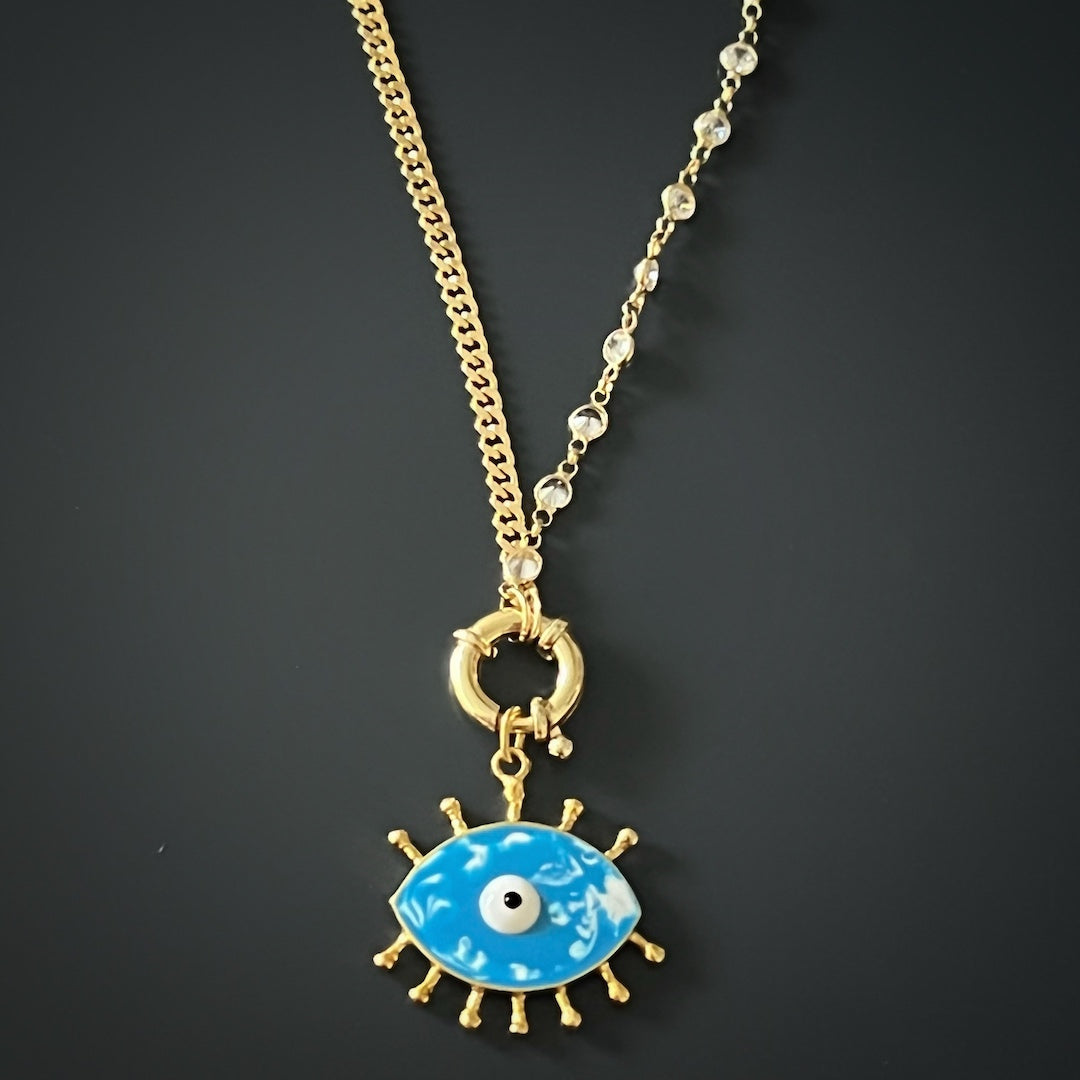 A top-down view of the Turquoise Evil Eye Chain Necklace, showcasing its delicate chain and vibrant blue enamel pendant.