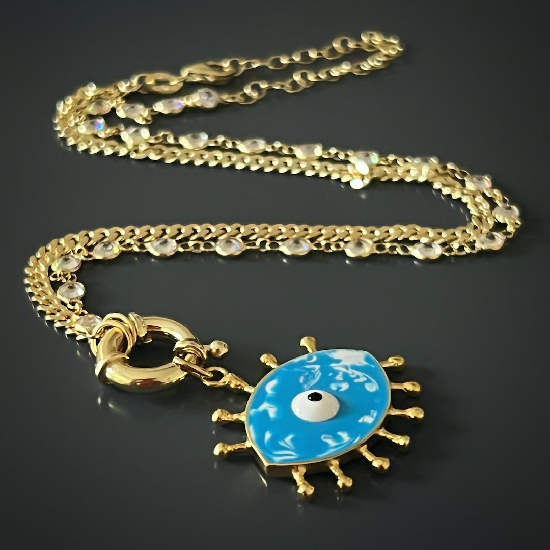 A detailed shot of the unique handmade Evil Eye pendant on the Turquoise Evil Eye Chain Necklace, reflecting its rich symbolism.