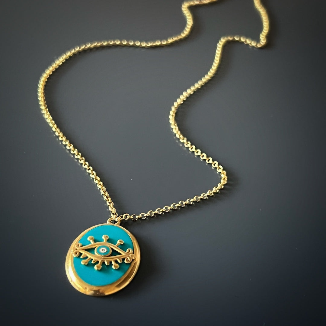 Embrace the spiritual significance of the Turquoise Gold Evil Eye Necklace, featuring a 925 sterling silver gold plated evil eye pendant.