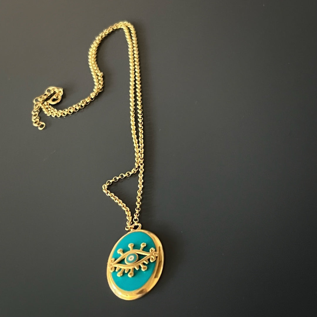 Protect yourself with the powerful symbol of the Turquoise Gold Evil Eye Necklace, a handmade piece designed for everyday wear.