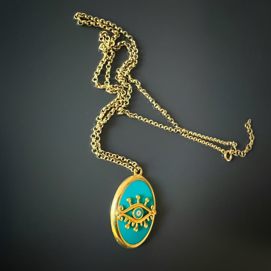 Adorn yourself with the Turquoise Gold Evil Eye Necklace, a simple and protective accessory handcrafted with care.