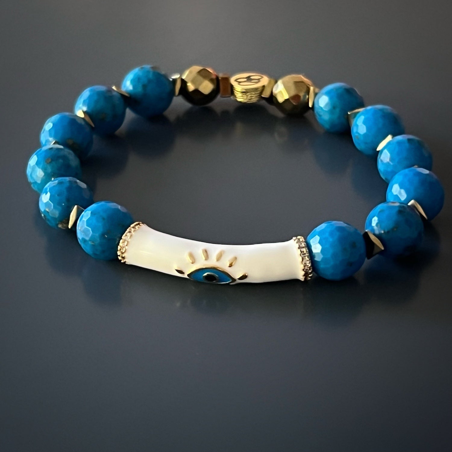 The Turquoise Inner Calm Bracelet radiates beauty and tranquility, adorned with gold-plated accents and faceted turquoise stones.