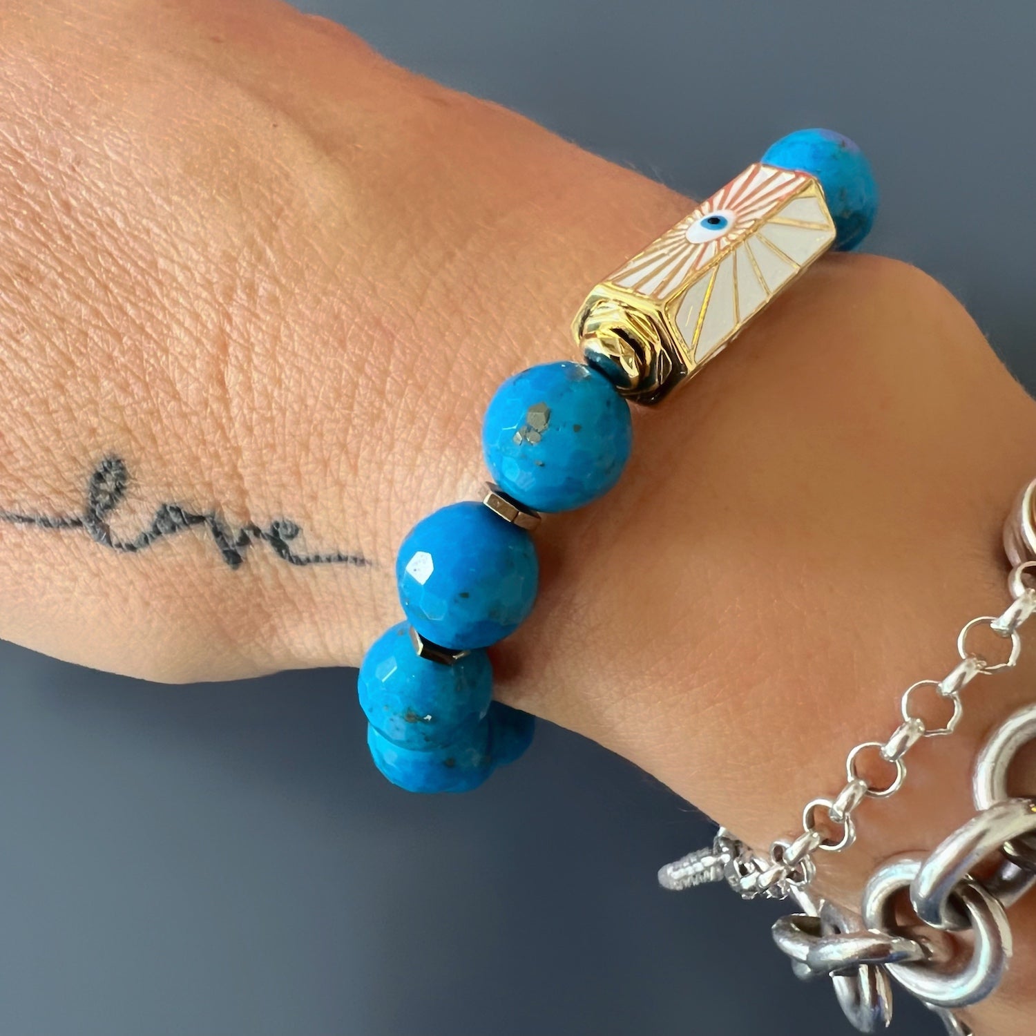 With the Turquoise Luck and Protection Bracelet on her wrist, the hand model exudes a sense of positivity and spiritual connection.