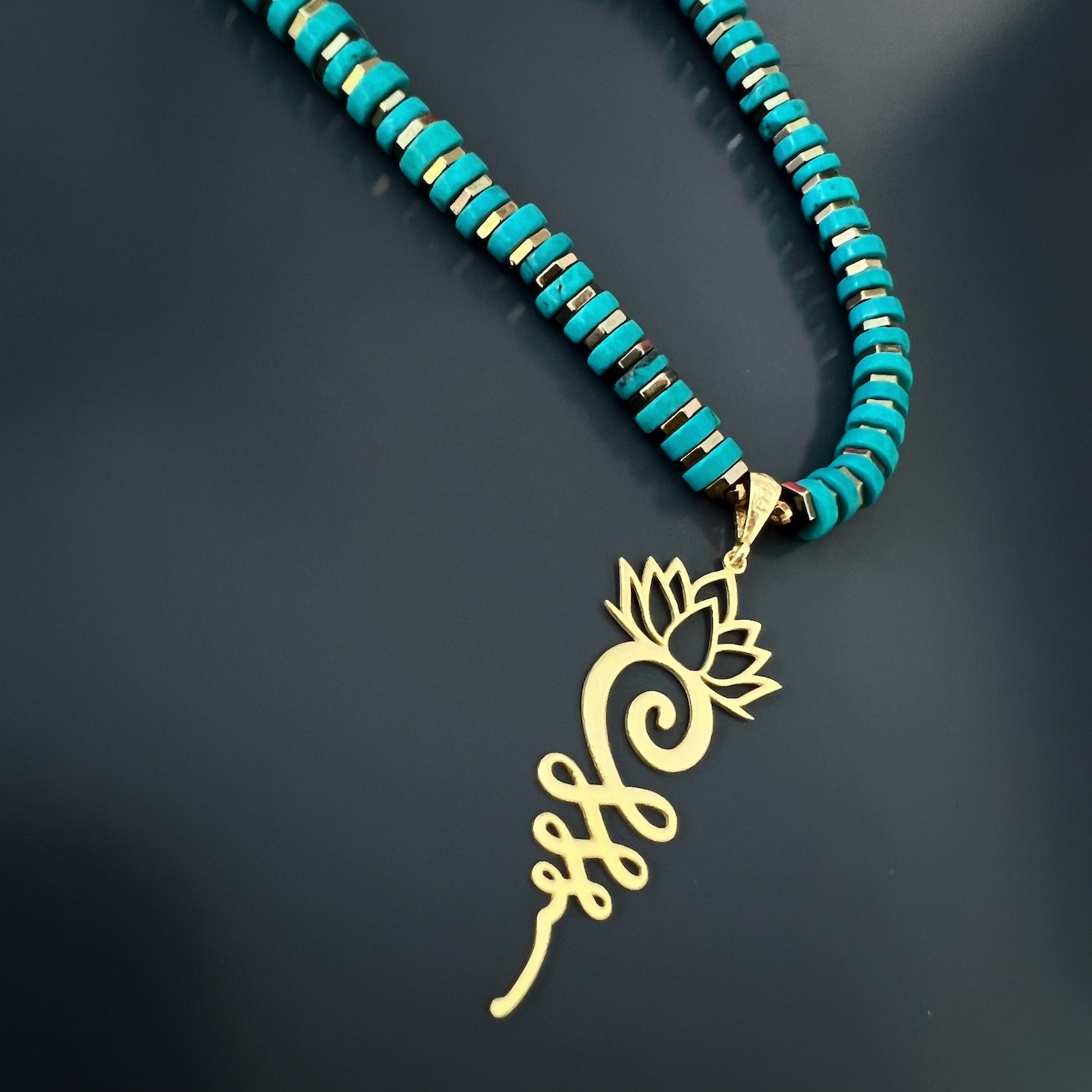 The symbolic Unalome Pendant on the Turquoise Unalome Serenity Necklace, representing the journey to enlightenment