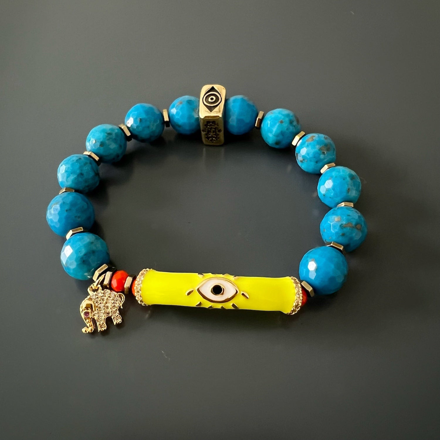 Explore the symbolism of protection with the Turquoise Unique Protection Bracelet, featuring powerful symbols and a turquoise centerpiece.