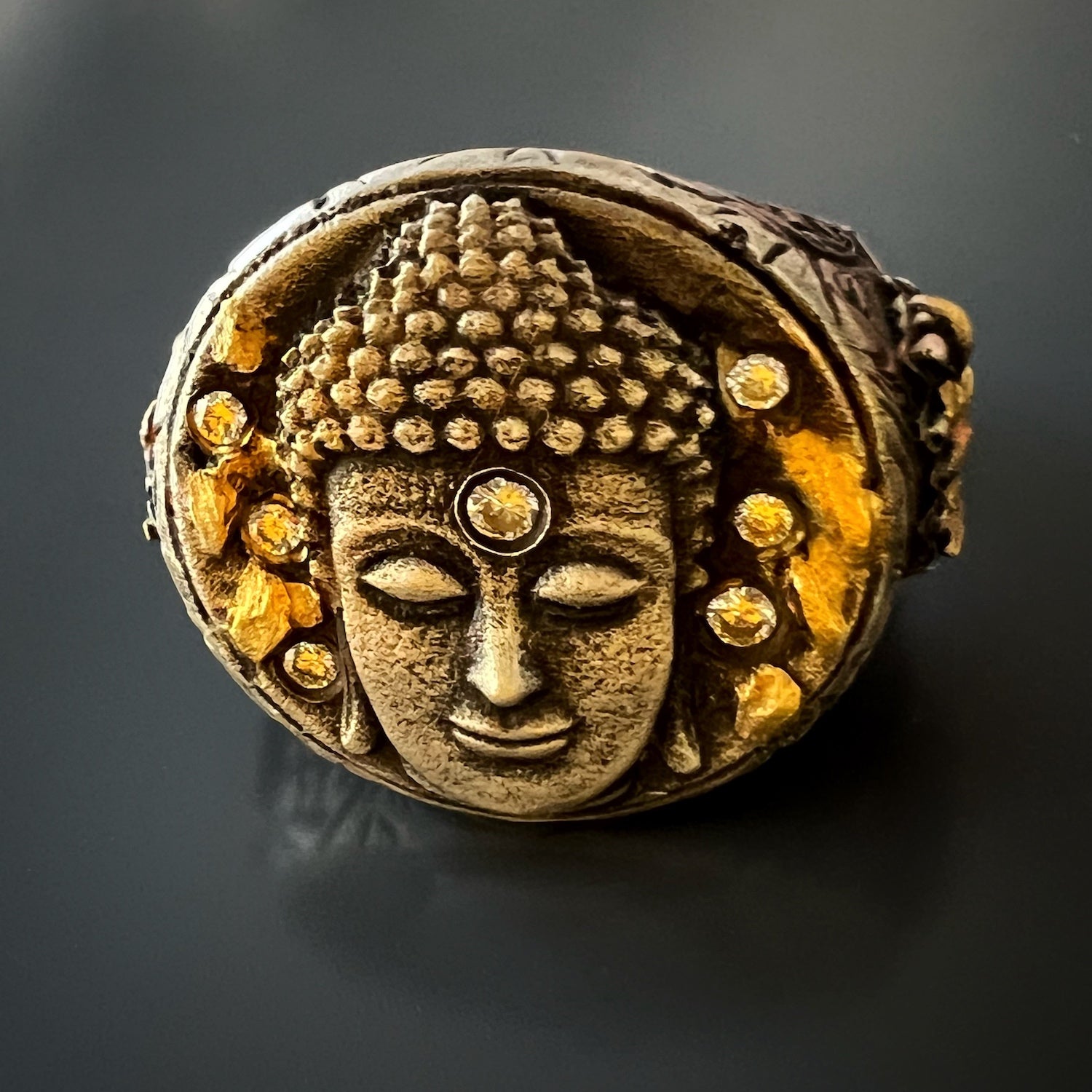 Luxurious Blend - Gold, Diamonds, and Silver in Unique Buddha Ring.