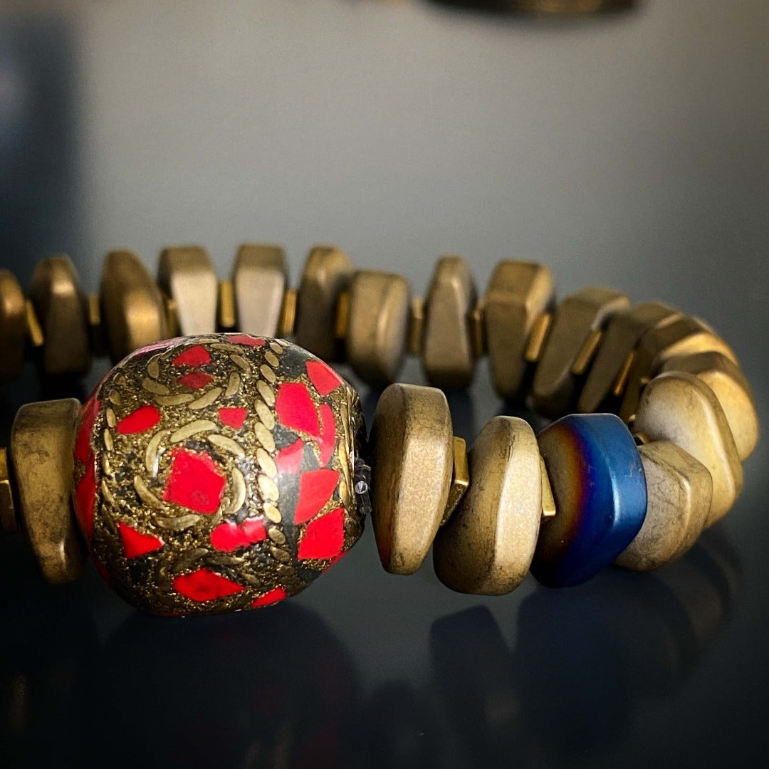 Admire the intricate craftsmanship of the Vintage Nepal Bracelet, showcasing a handmade Nepal bead and vibrant gemstones.