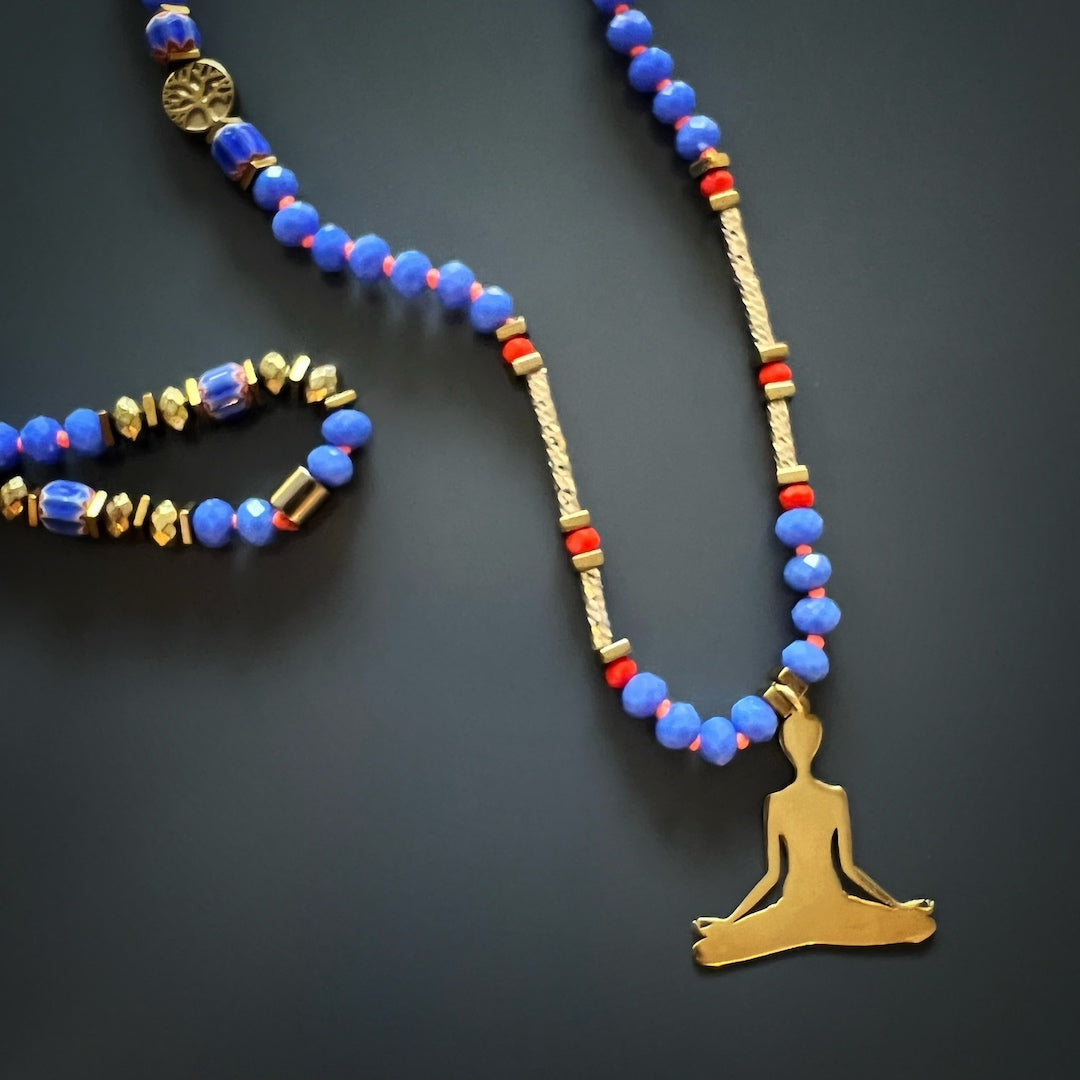 Necklace showcasing the beauty of blue crystal beads, gold hematite spacers, and a Nepal Om Mani Padme Hum mantra bead, perfect for meditation practice.