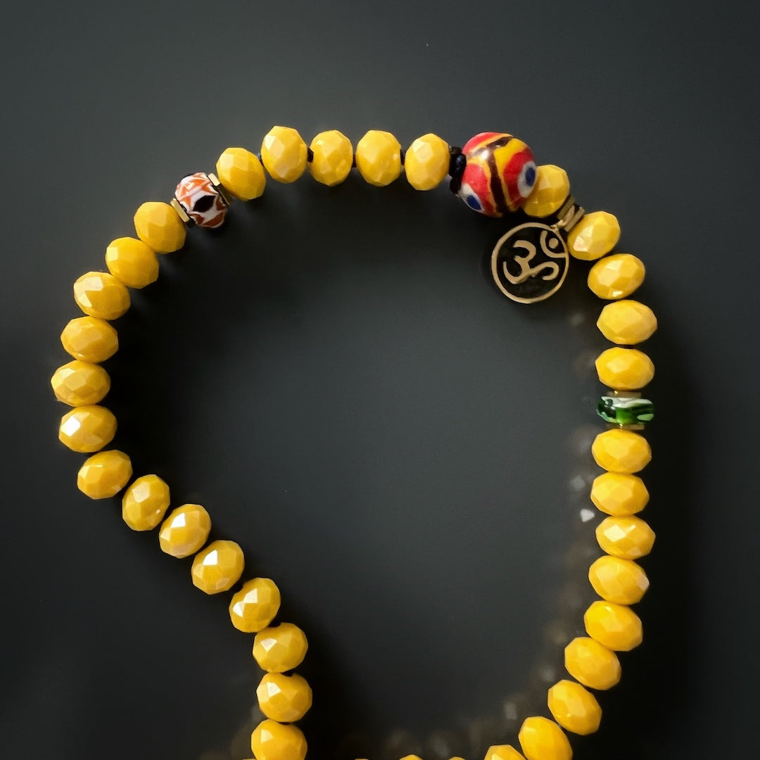 Handmade Yoga Serenity Necklace with vibrant crystal and African bead accents.