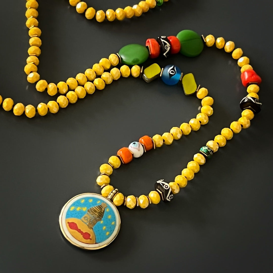 The Yoga Serenity Necklace combines vibrant colors and meaningful symbols to inspire a sense of serenity.