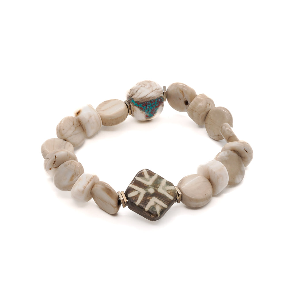 Beautiful African Bone Beads bracelet with cream-colored African seed beads and a lovely Nepal bead, handmade in the USA