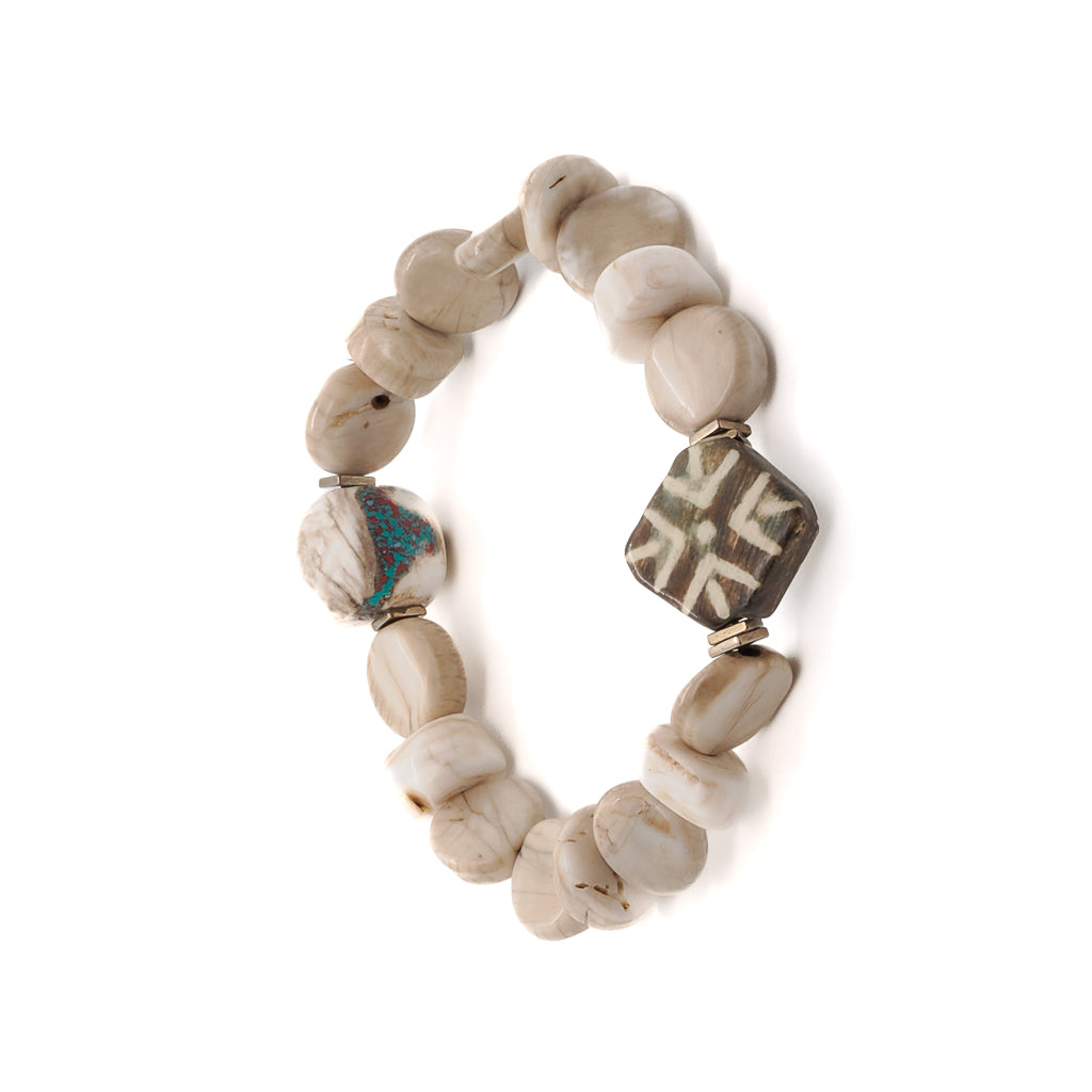 Beautiful African Bone Beads bracelet with natural wood geometric Nepal bead and handmade white and green Nepal bead, modeled for a unique and stylish look