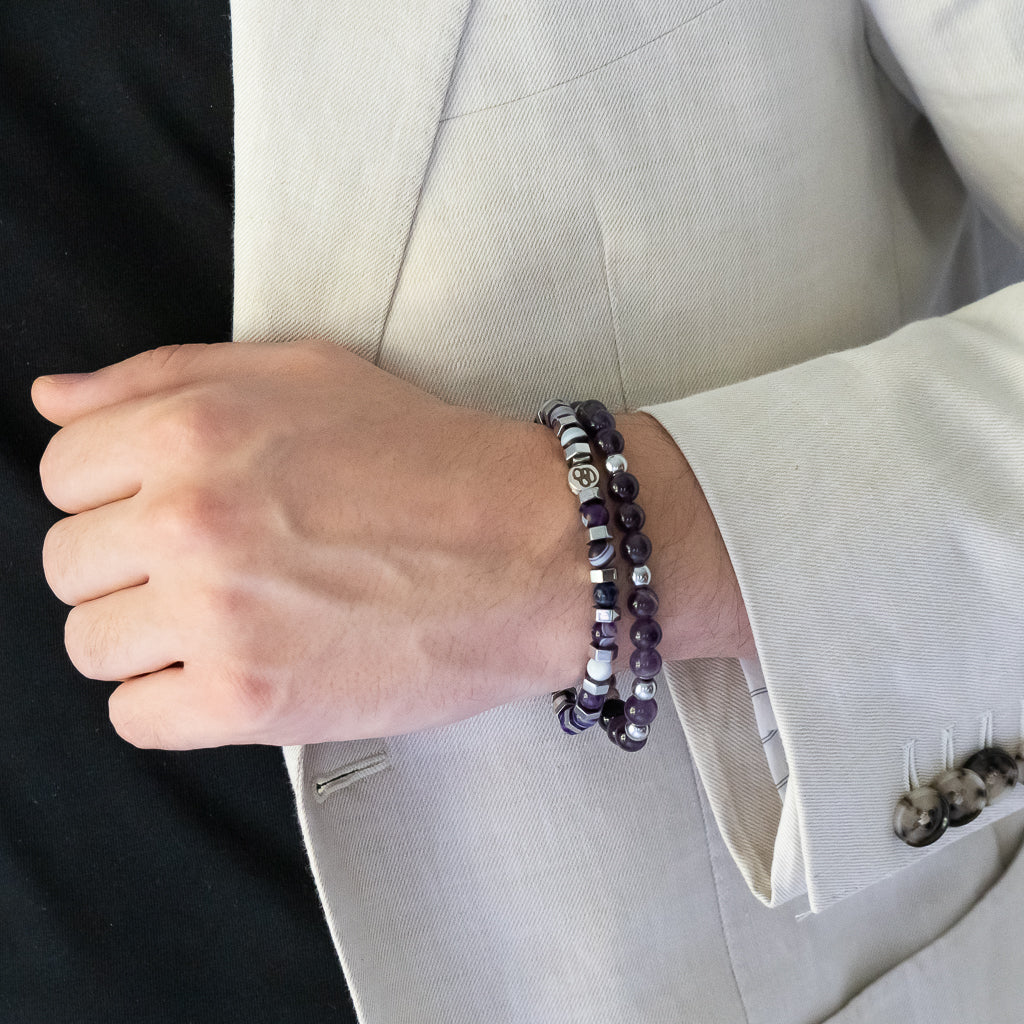 A model wearing Handcrafted Agate Aura Bracelet with 7mm purple color agate stone beads and silver color nugget hematite beads