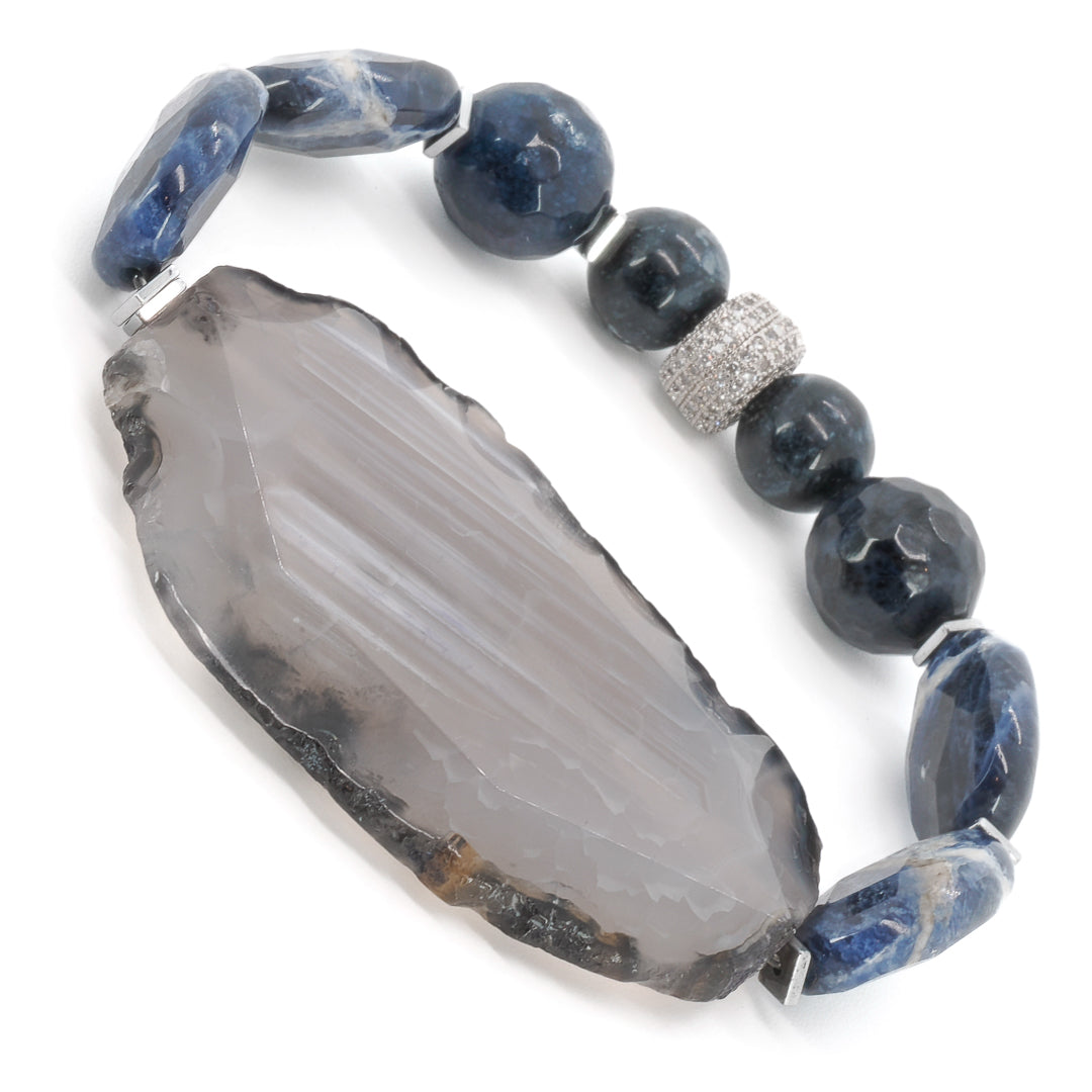 A photo of the Agate Spiritual Balance Bracelet displayed on a white background, showcasing its beautiful and unique combination of chunky agate stones, smooth sodalite stones, and Swarovski crystals.