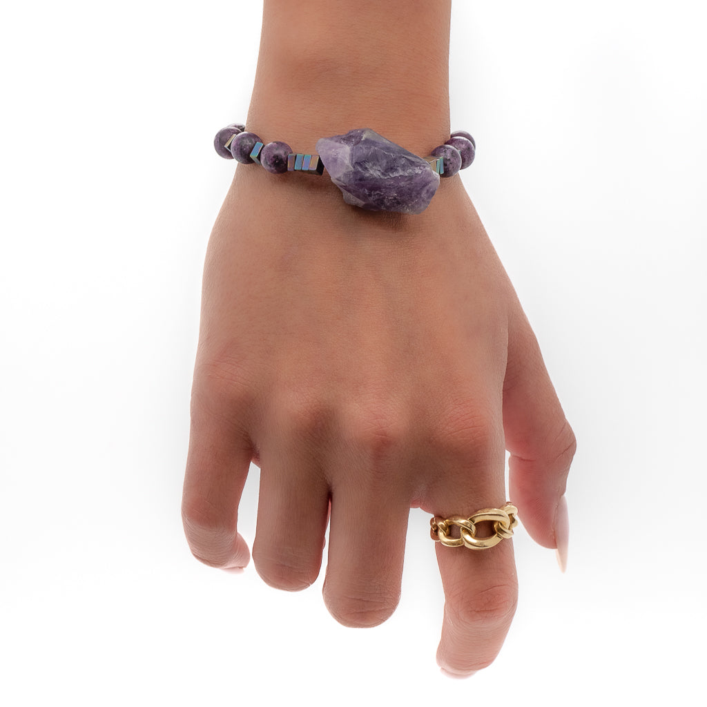 A model wearing to feel grounded and protected with the colorful hematite stones in this bracelet
