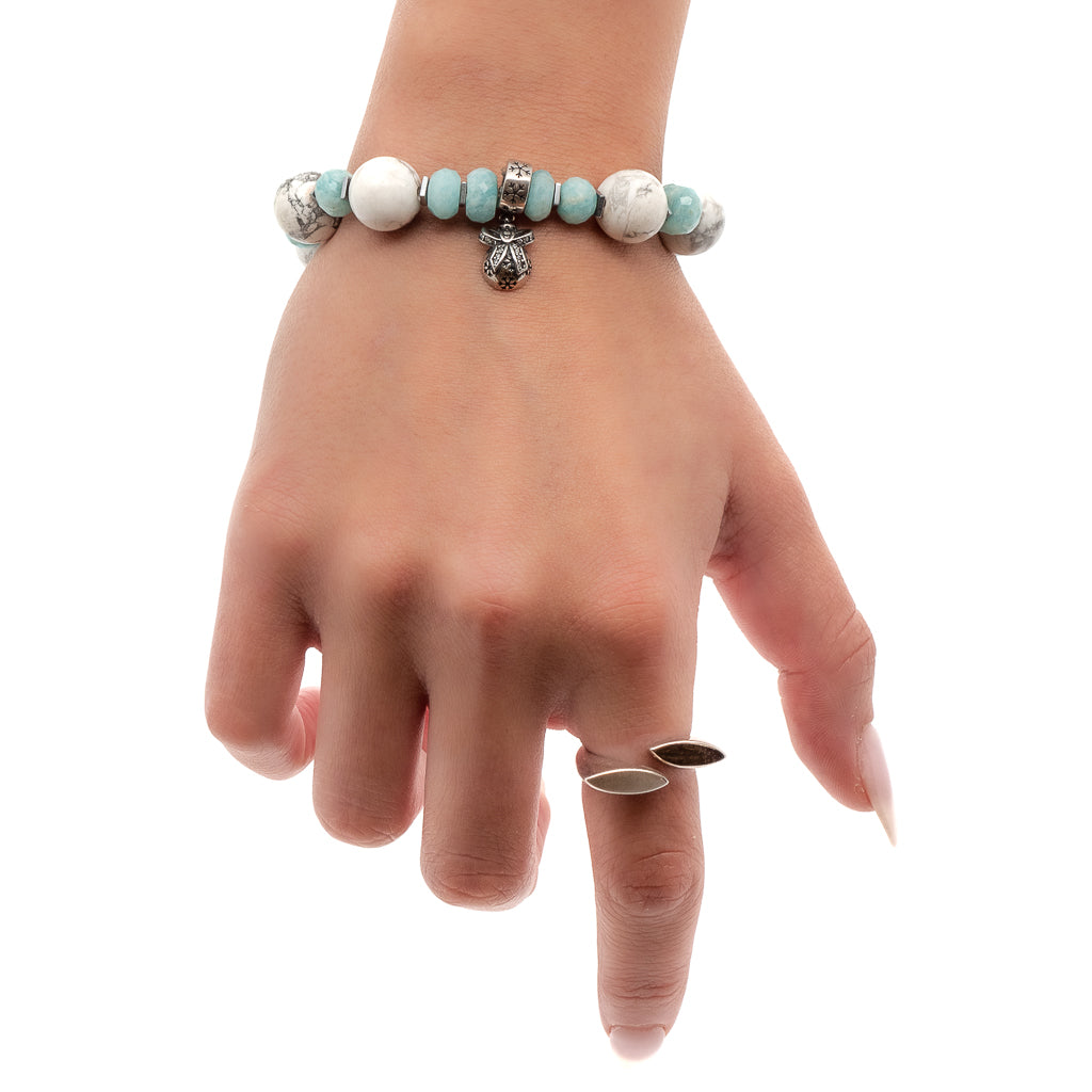 A model wearing the Aquamarine Christmas Bracelet while still highlighting the beauty and uniqueness of this handmade piece.