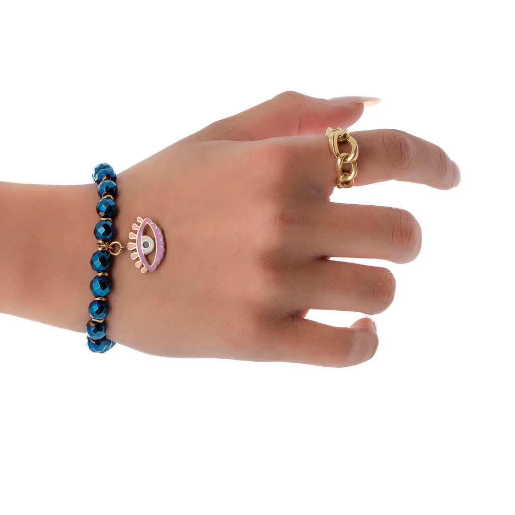 Hand Model Wearing Artemis Bracelet with Hematite Stones and Evil Eye Charm