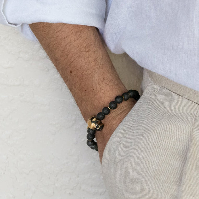 Model wearing Black Dog Charm Bracelet with bronze dog charm and skull bead, adding an edgy touch to her outfit