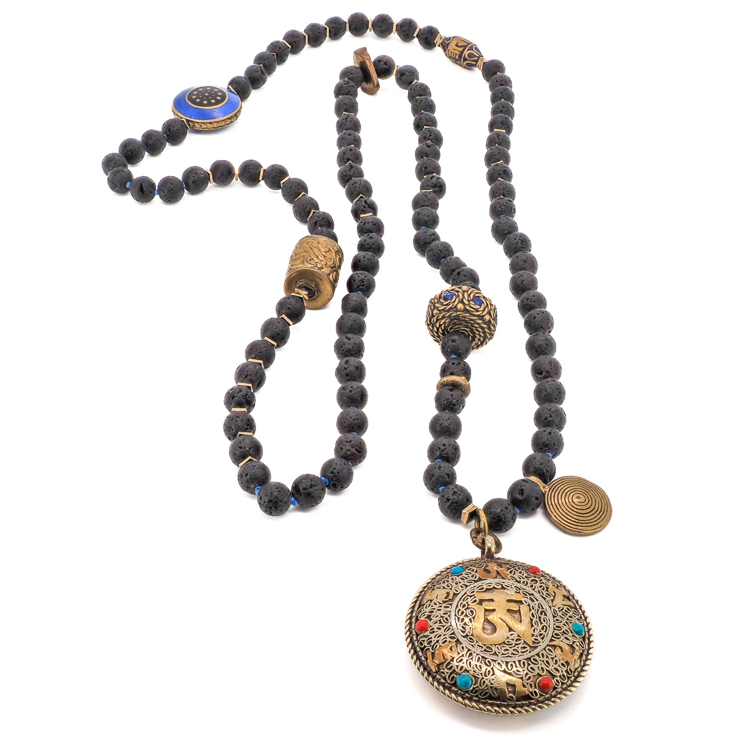 This &quot;Black Nepal Om Mala Mantra Necklace&quot; features a stunning brass handmade Nepal spiral charm and a large brass handmade Nepalese bead with lapis lazuli inlay.