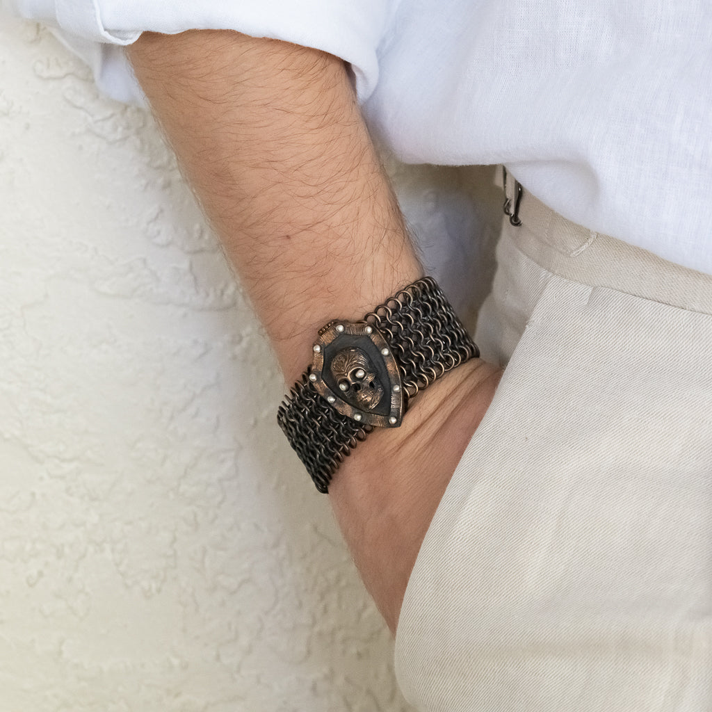 Model wearing the Bronze Skull Men Bracelet, showcasing its stylish and edgy design.