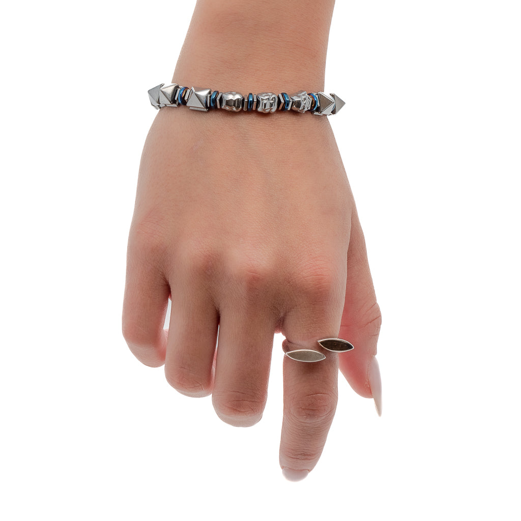 Another image featuring a hand model wearing the Buddha Energy Bracelet, highlighting its silver hematite pyramid beads and Buddha bead on the wrist.