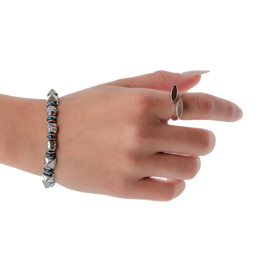 A hand model wearing the Buddha Energy Bracelet, showcasing its stylish design and unique beads