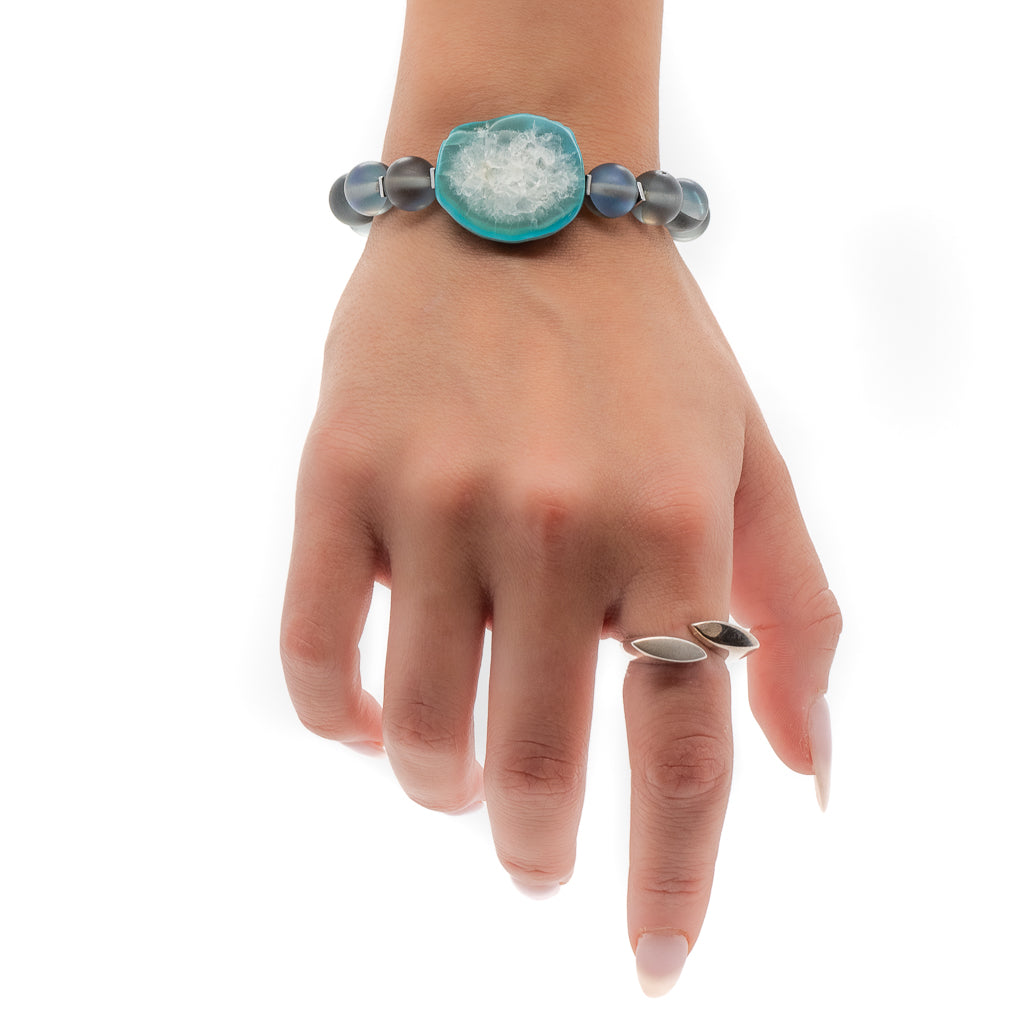 Adorned with the Cat Eye Bracelet with Aqua Amazonite Bead, our hand model exudes confidence and sophistication with this stunning accessory
