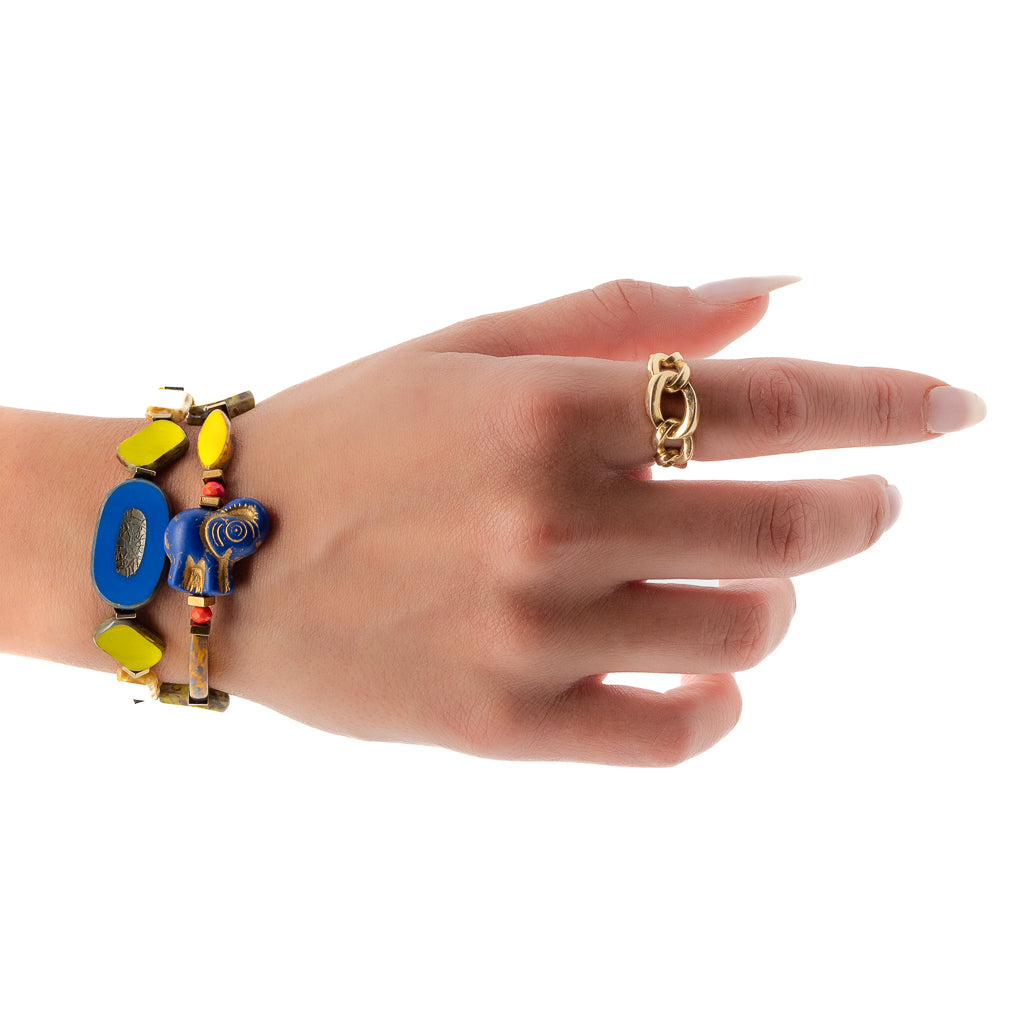Hand model wearing the Cheerful Elephant Bracelet Set, showcasing its bohemian style and vibrant colors.
