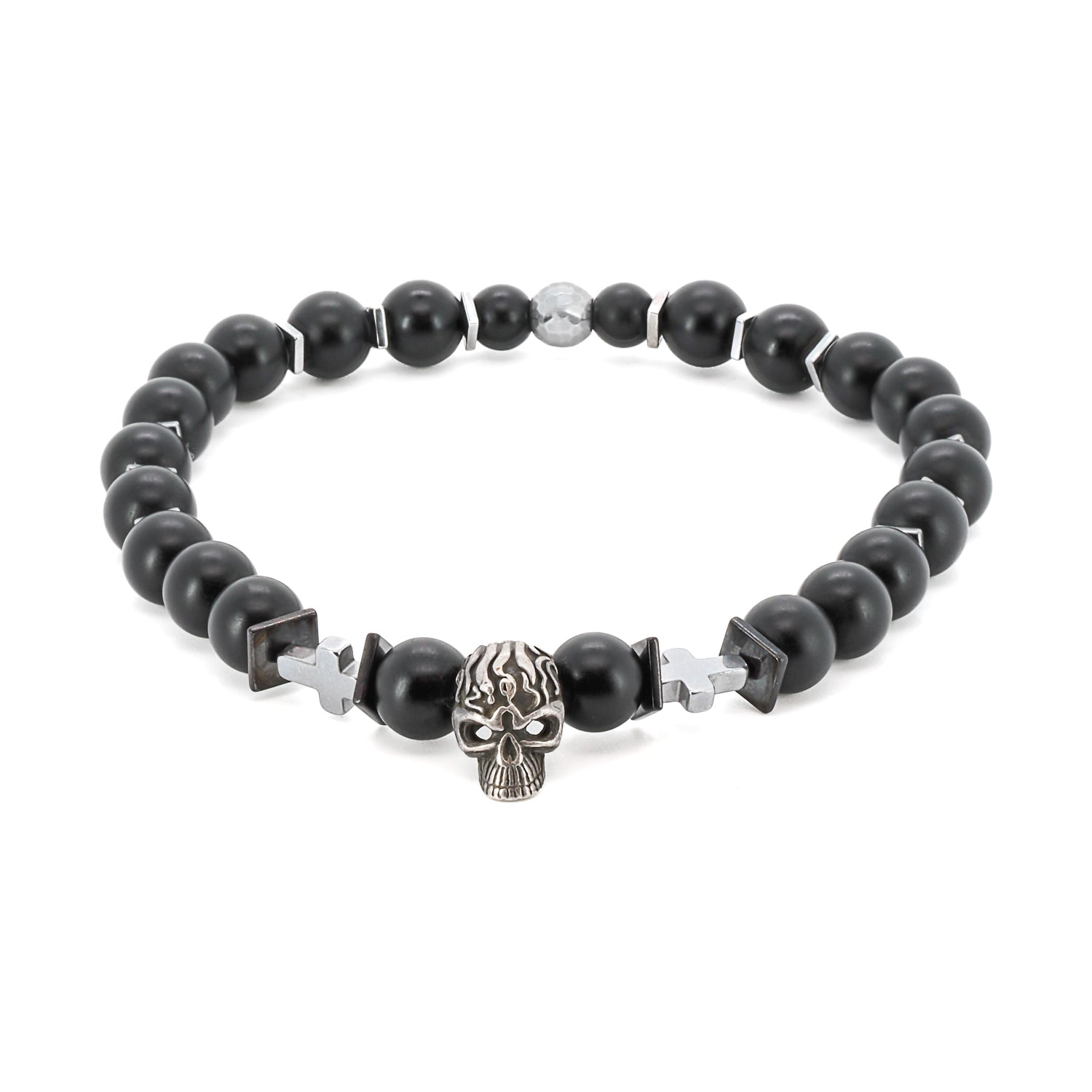Featuring a sterling silver skull bead at its center, this handmade bracelet symbolizes transformation and embracing the impermanence of life. 