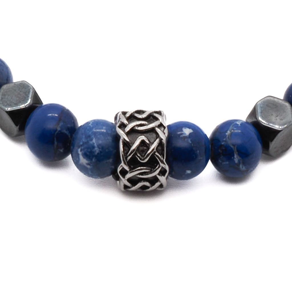 A close-up image of the Deep Blue Bracelet, highlighting the nurturing properties of the blue jasper stone beads and the peaceful qualities of the white howlite stone beads. The combination promotes balance and tranquility.