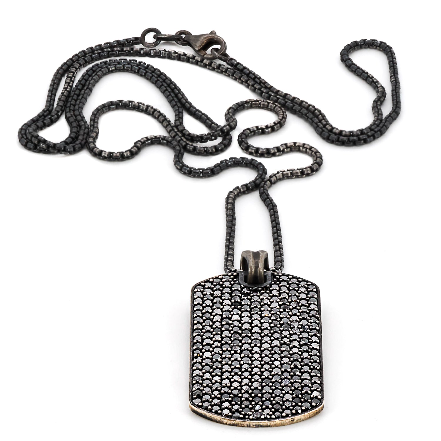 Top view of the stunning Dog Tag Black Diamond Necklace, highlighting the pendant&#39;s unique design and craftsmanship.